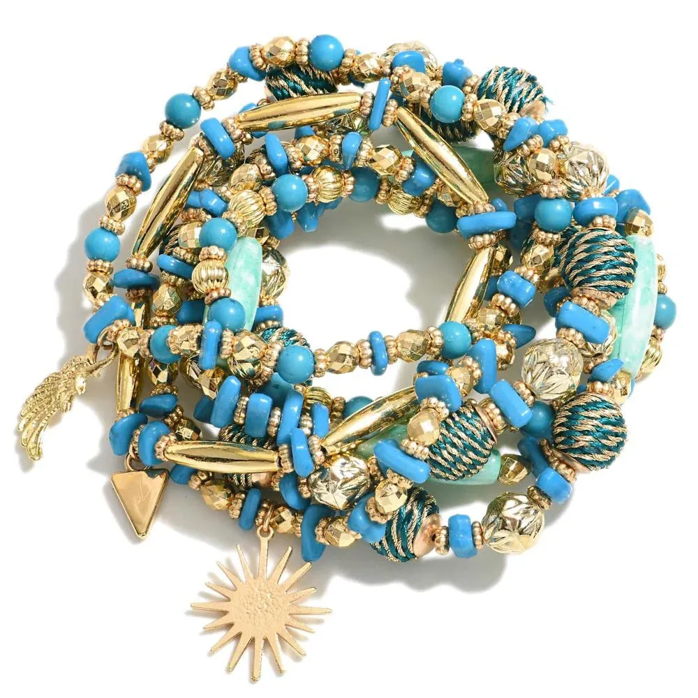 Blue Set of Nine Beaded Stretch Bracelets With Wing & Sun Charms