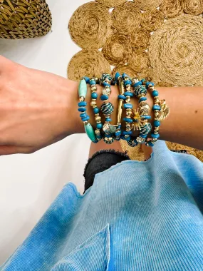 Blue Set of Nine Beaded Stretch Bracelets With Wing & Sun Charms